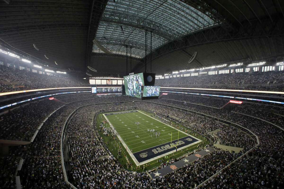 In this Sept. 8, 2013, file photo, fans watch at the start of an NFL football game between the New York Giants and Dallas Cowboys, in Arlington. The Dallas Cowboys not only are the NFL’s most valuable franchise for the 11th straight year, they are the top-valued team in the world. According to Forbes magazine, their worth increased 14 percent in the last year, reaching $4.8 billion.
