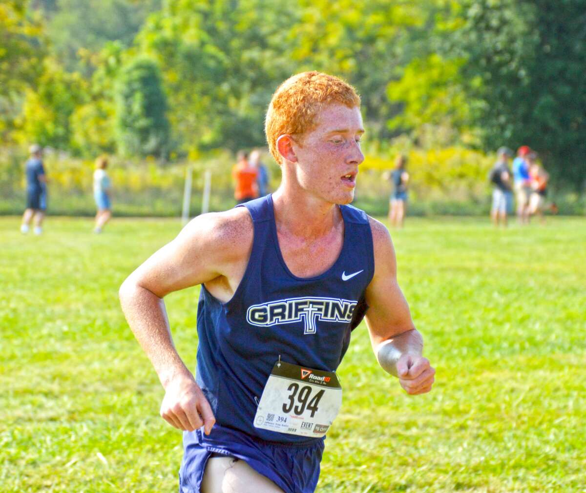 Father McGivney freshman Ross Bushur competes in the Edwardsville Invite on Saturday at the SIUE cross country course.