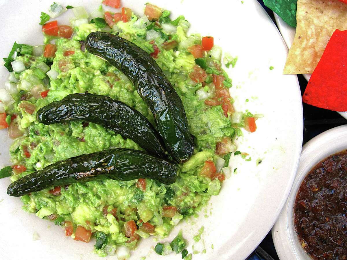Tableside guacamole with roasted serrano peppers from La Fogata.
