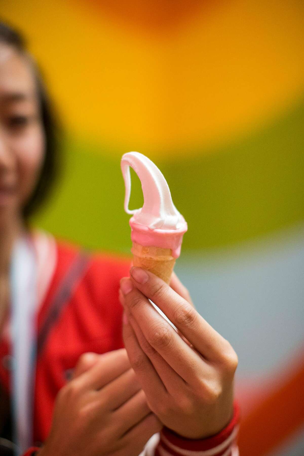 Holly Vo tries an ice cream treat described as Unicorn Milk Ice Cream at the Museum of Ice Cream in San Francisco, Calif., on Sunday, September 17, 2017. 