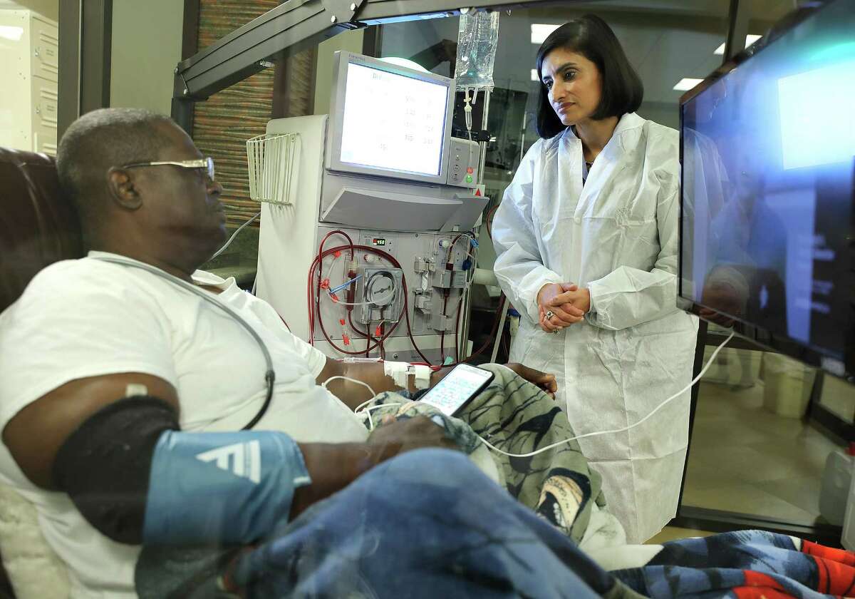 Seema Verma, director of the Centers for Medicare and Medicaid, talks with Zachary Gay as he's given dialysis Monday. ﻿