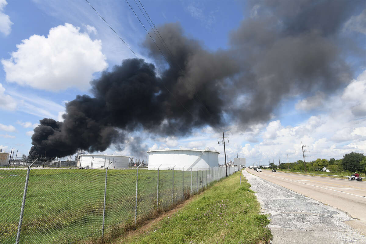 Smoke and fire rise from a heavy oil tank at Valero's Port Arthur facility on Wednesday. No injuries were reported in the incident. Area residents were asked to shelter in place by city officials. Photo taken Wednesday, September 19, 2017 Guiseppe Barranco/The Enterprise