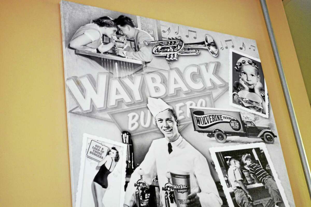 Vintage photographs adorn the walls of Wayback Burgers in Middletown’s Metro Square.