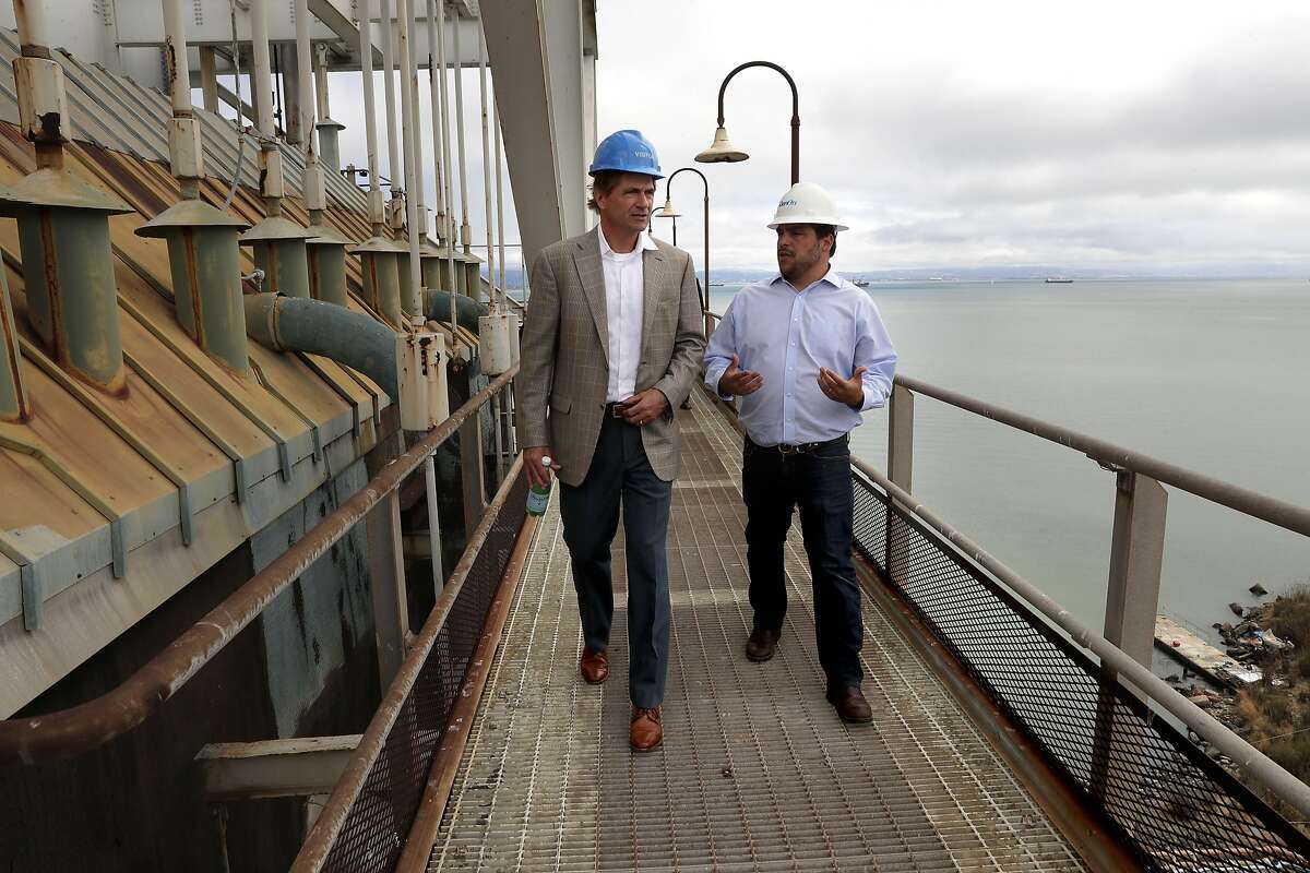 Greg Johnson, (left) managing director with Perkins + Will, and Enrique Landa, project sponsor, principal Associate Capital, atop the Potrero Hill power plant, where plans are underway for the development of the site in the Dogpatch neighborhood of San Francisco, Ca., as seen on Monday September 18, 2017.