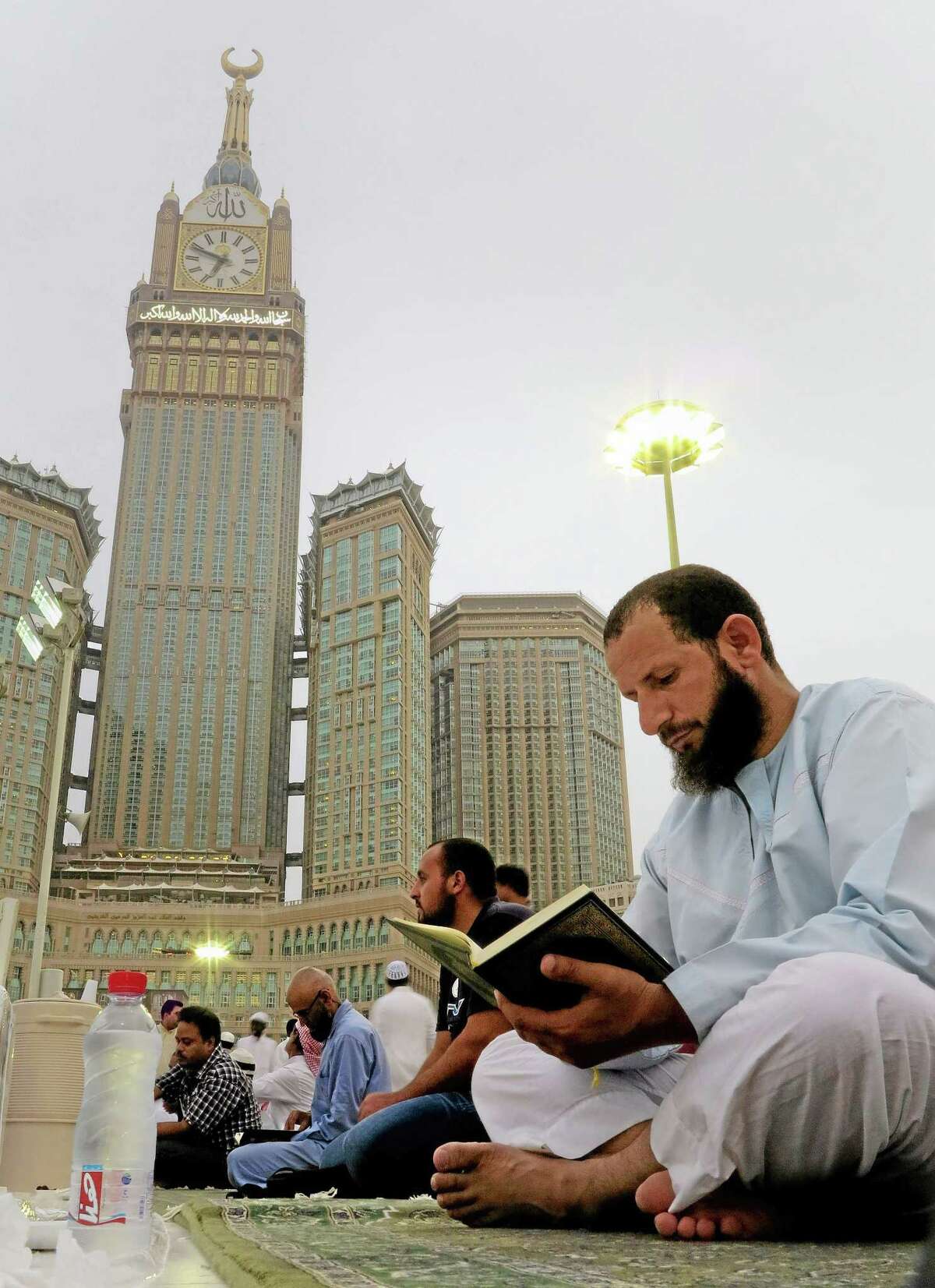 A worshipper reads Islam’s holy book Quran at the Grand Mosque in the holy Muslim city of Mecca, Saudi Arabia.