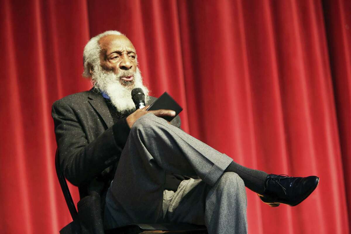 In this Jan. 20, 2016 photo, long time civil rights activist, writer, social critic, and comedian Dick Gregory, talks to the crowd at the 16th annual Tampa Bay Black Heritage Festival, MLK Leadership Luncheon, at the University Area Community Development Center, in Tampa, Fla. Gregory died late Saturday, Aug. 19, 2017, in Washington, D.C. after being hospitalized for about a week, his son Christian Gregory told The Associated Press.