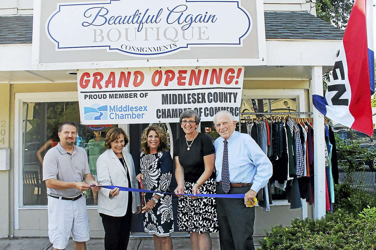 Beautiful Again Boutique held a grand opening Aug. 10 at 204 Main St., Portland. Shown, from left, are: Middlesex County Chamber of Commerce Chairman Rick Morin, Portland First Selectman Susan Bransfield, owner Liz Rogers, Portland Economic Development Consultant Mary Dickerson and Chamber President Larry McHugh.
