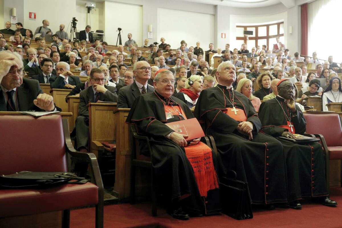 From left, former Chairman of the Vatican Bank Ettore Gotti Tedeschi, Cardinals Raymond Leo Burke, Gerhard Ludwig Mueller, and Robert Sarah attend a conference on the Latin Mass at the Pontifical University of St. Thomas Aquinas in Rome, Thursday, Sept. 14, 2017.