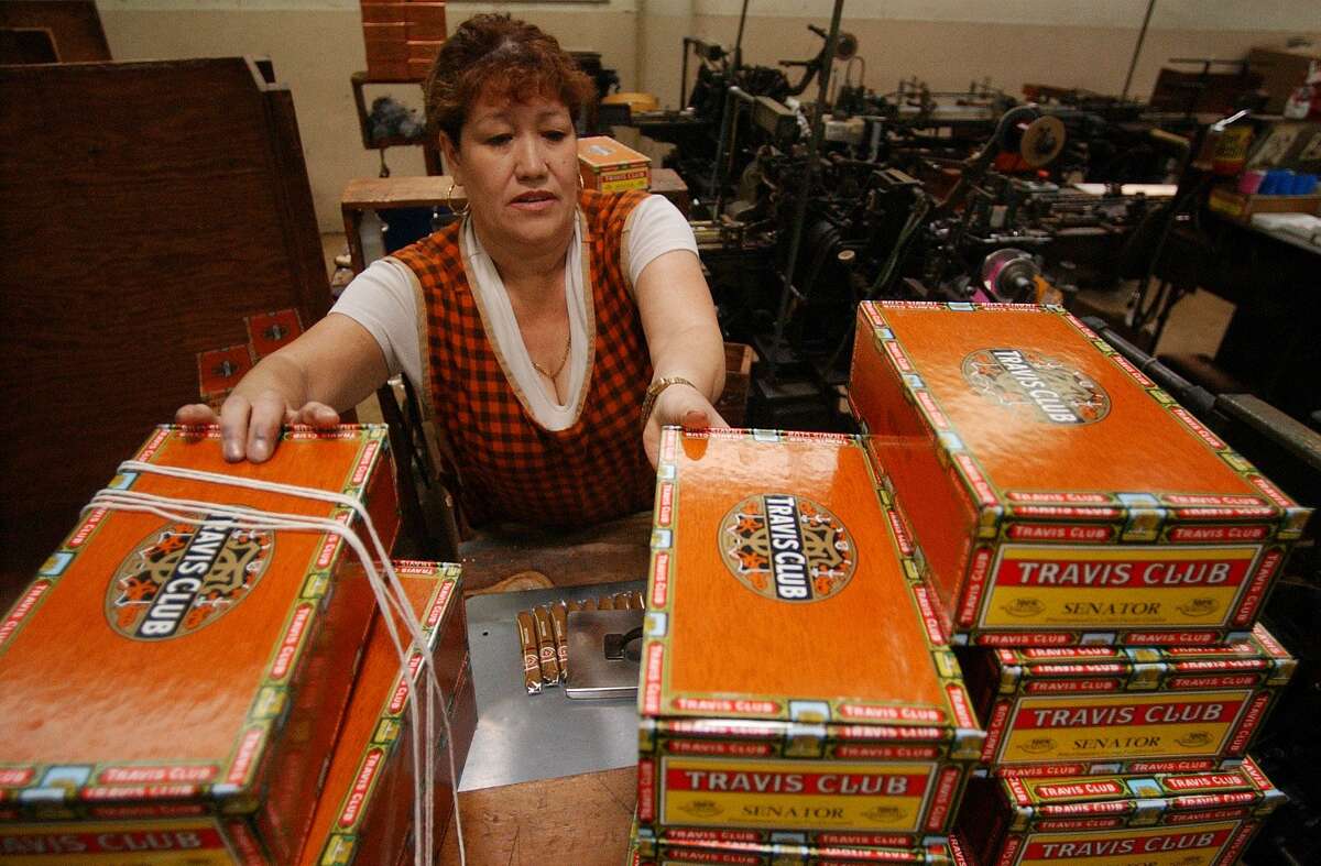 Antonia Soto boxes up cigars at the Finck Cigar Co. in San Antonio in 2004. The company stopped production at its San Antonio factory in 2014.