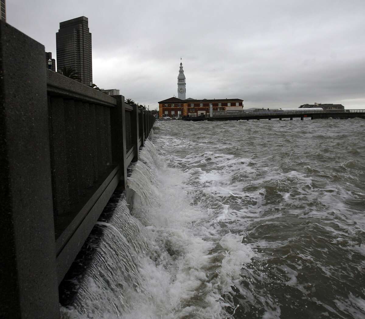 WEATHER_SF016_KK.JPG Water from waves from the bay spills back from the Embarcadero bnear Howard Streetas a winter storm hits San Francisco Tuesday. Photo by Kim Komenich/The Chronicle **