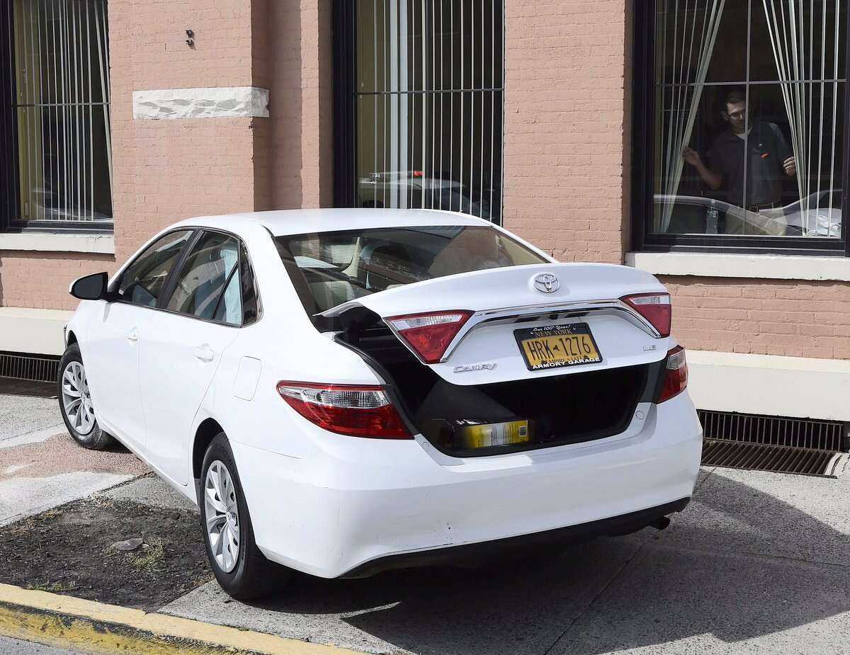 Photo Car slams into Rensselaer County office building