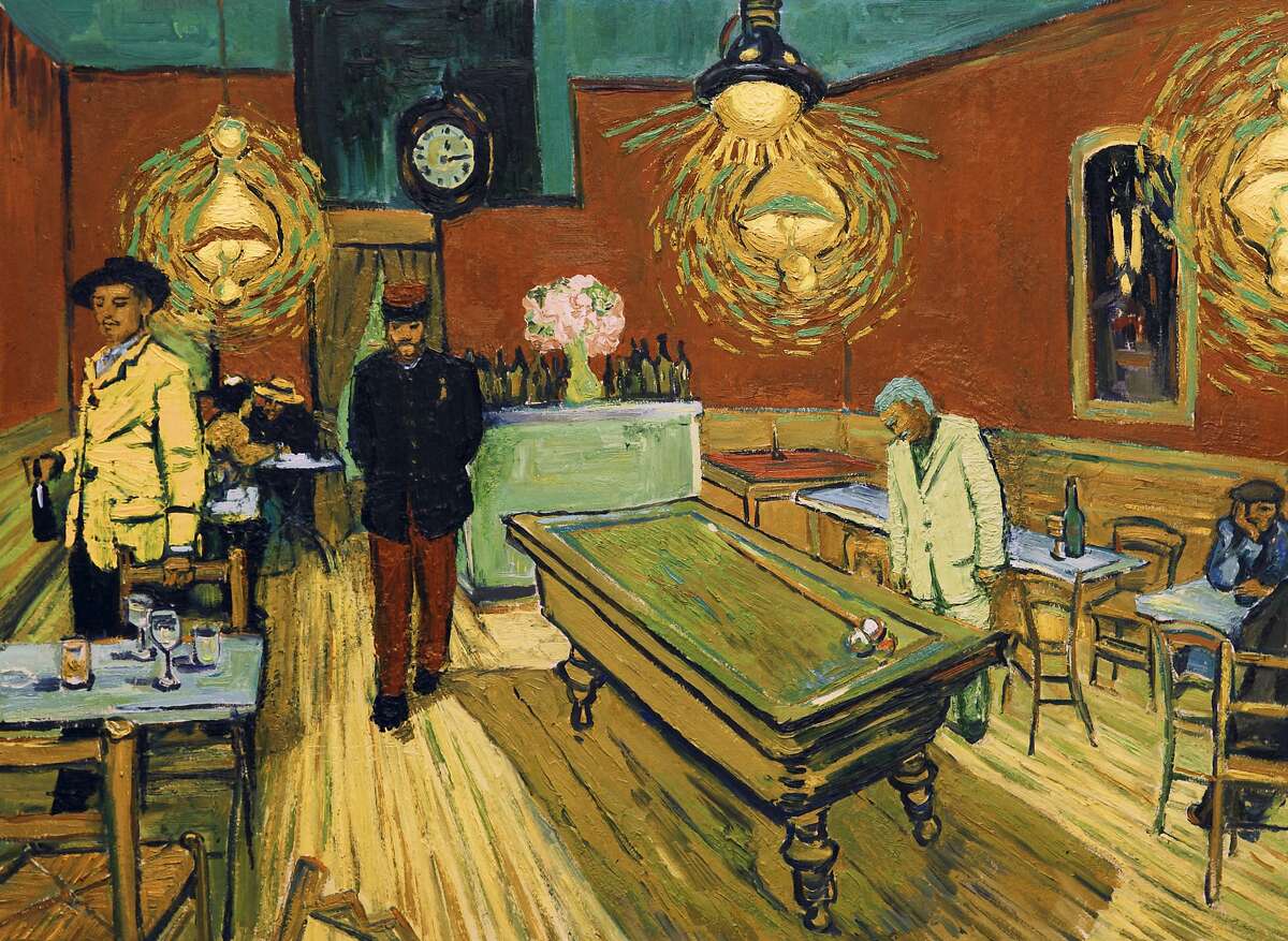 Robin Hodges as Lt. Milliet and Douglas Booth as Armand Roulin in a cafe scene in "Loving Vincent."