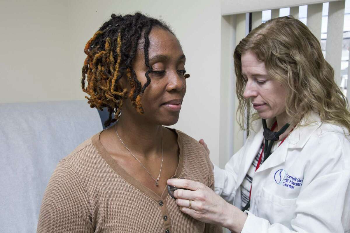 Latoya Armstrong, left, gets checked at Cornell Scott Hill Health Center in New Haven. In 2016, the costs of employer-based health plans rose 3 percent to $21,000 in the Northeast, compared to a 20 percent increase for coverage in state-based insurance exchanges nationally.