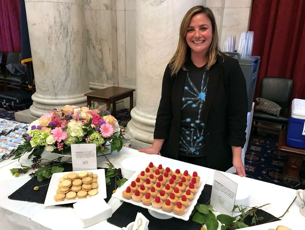 Leyla Dam Jenkins, owner of Lorca, a coffee-pastry shop on Bedford Street in Stamford, displays delicacies at D.C.?’s fourth annual ``Discover Connecticut,?’?’ which showcases a host of CT drink and food producers and other businesses on Capitol Hill.