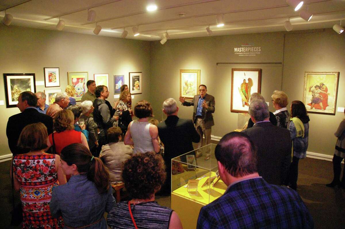 Stephen Korshak, owner of the “Korshak Collection, Illustrations in Imaginative Literature,” talks about his collection at a sneak preview Sept. 14 of the Stamford Museum & Nature Center exhibition that runs Friday through Oct. 29.