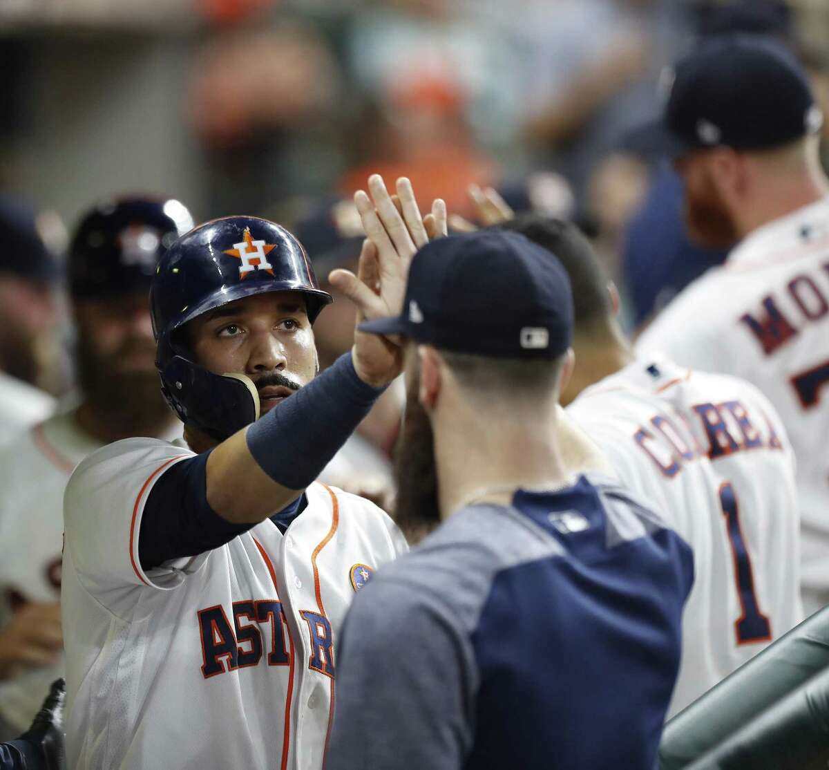Astros’ Marwin Gonzalez (left) celebrates his run scored on Yuli Gurriel’s RBI double during the fourth inning against the Chicago White Sox at Minute Maid Park on Sept. 20, 2017, in Houston.