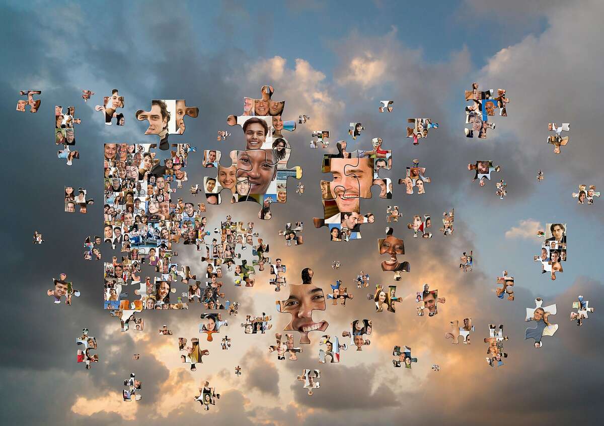 Puzzle pieces with smiling faces floating in cloudy sky