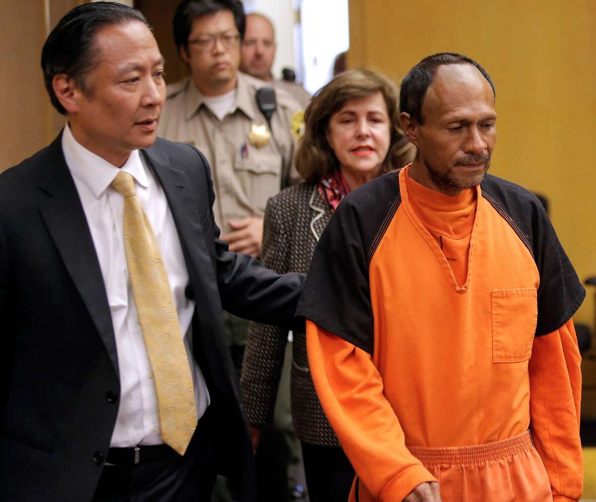 San Francisco Public Defender Jeff Adachi, (left) leads Juan Francisco Lopez-Sanchez, into the Hall of Justice in San Francisco, Calif. on Tues. July 7, 2015, for his arraignment on suspicion of murder in the shooting death of Kate Steinle on San Francisco‚Äôs Pier 14 last Wednesday.