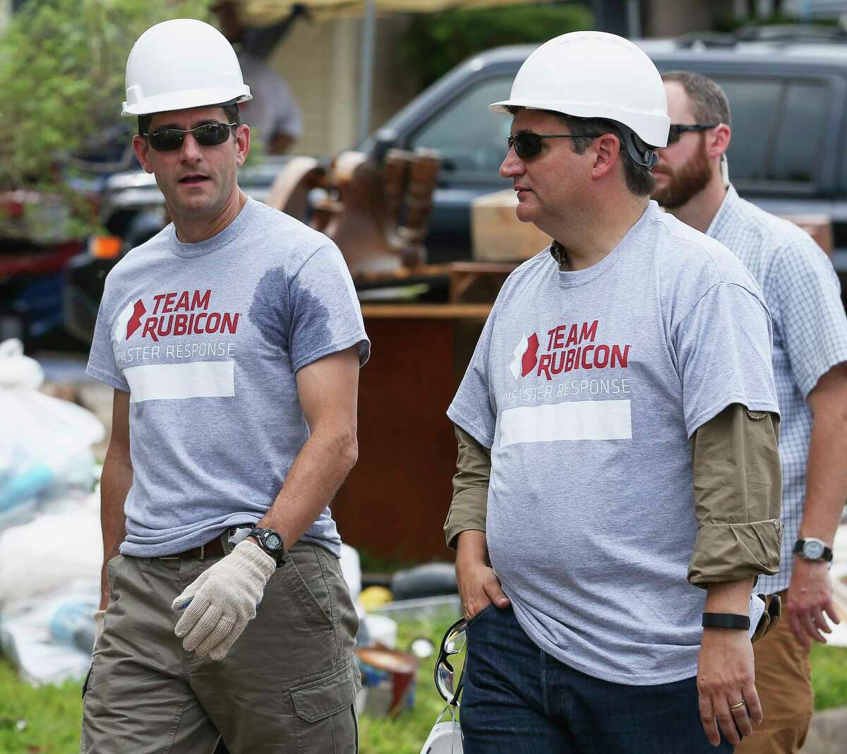 House Speaker Paul Ryan, left, and Sen. Ted Cruz ﻿arrive﻿ Thursday to assist Team Rubicon Disaster Response in cleaning out a house in Friendswood. ﻿