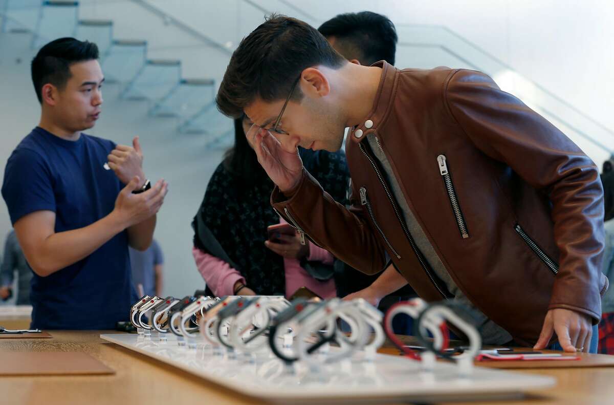 Billy Rosen browses through the Apple Watch Series 3 display before purchasing one after it went on sale to the public at the Union Square Apple Store in San Francisco, Calif. on Friday, Sept. 22, 2017.