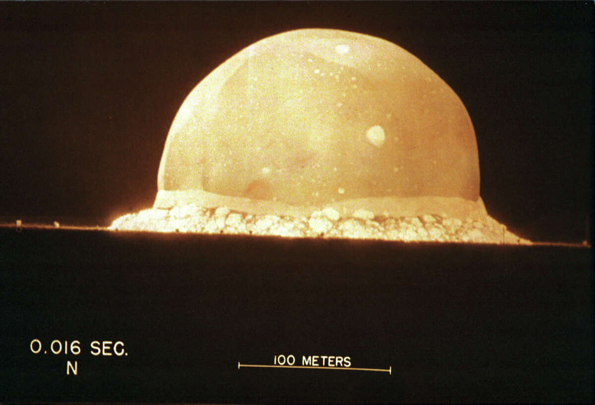 A photograph on display at The Bradbury Science Museum shows the first atomic bomb test On July 16, 1945, at 5:29:45am, at Trinity Site in New Mexico, U.S.A. The museum is Los Alamos National Laboratory's window to the public. The museum displays the laboratory's current research and presents the history of the laboratory's role in the Manhattan Project during World War II.