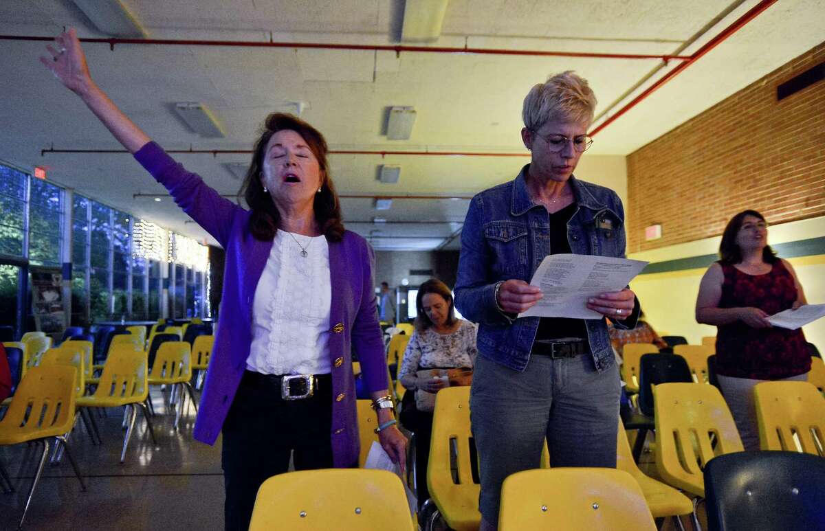 From left, Nancy Henkes and Lisa Steigerwald, both of Greenwich and members of the Presbyterian Church of Old Greenwich, participate in a Night of Unity and Peace service at Trinity Catholic High School in Stamford, Connecticut on Thursday, Sept. 21, 2017. The event, in connection with the United Nation's International Day of Peace, featured music led by Angelo Natalie and Dani Wasserman. Ecumenical speakers including Rev. Bill Gestal from Presbyterian Church of Old Greenwich, Rico Arocha from Young Life Youth Ministry and Father Joseph Gill, Chaplain at Trinity Catholic High School. Also, Christian rap artist, Zabbai, performed before members of various area congregations and churches during a night of Peace, Prayer and Worship.