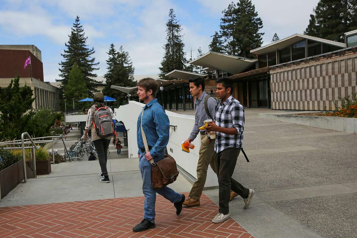 (l-r) Mike Wright, Bryce Kasamoto and Pranav Jandhylala walk out of a cafe as they look for a spot to eat at UC Berkeley in Berkeley, Calif., on Wednesday, Sept. 20, 2017. They are all part of the Berkeley Patriot.