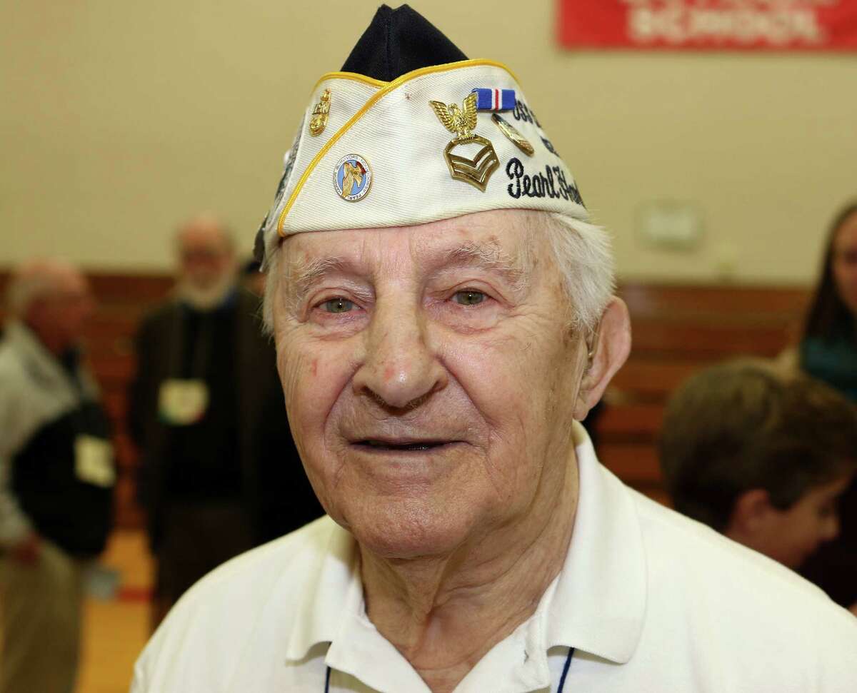 Photo by John Fitts East Canaan resident and Pearl Harbor survivor Isadore Tadiello introduces himself at the Assembly in Honor of Veterans at Botelle Elementary School in Norfolk on Wednesday morning. Tadiello served in the U.S. Navy from 1940 to 1946.