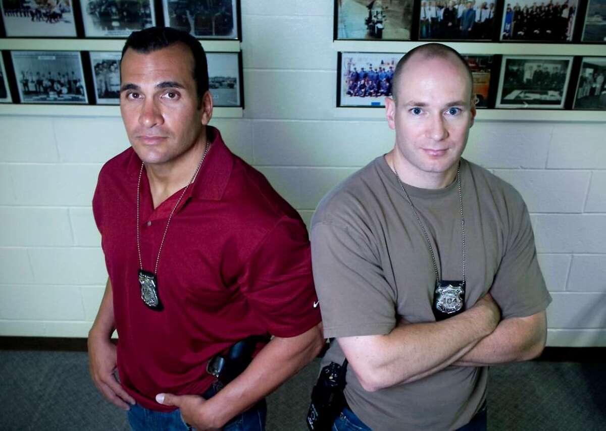 Stamford Police officers Richard Gasparino and Adrian Novia, both with the Narcotics & Organized Crime Unit, will be honored as 2010 Officers of the Year at an event at The Italian Center. They are photographed in the Stamford Police Station in Stamford, Conn. on Wednesday June 23, 2010.