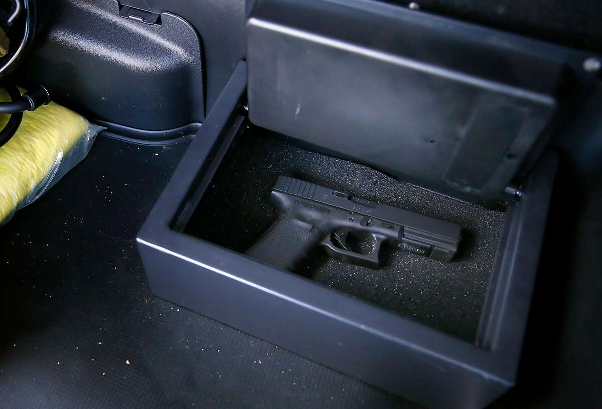 The Santa Clara County Sheriff took a proactive approach in October 2016 and purchased 750 portable gun vaults for her deputies' personal vehicles including this vault in Captain Robert M. Durr's vehicle on Friday, September 22, 2017, in San Jose, Calif. Since then, no guns have been stolen from a Santa Clara County deputy.