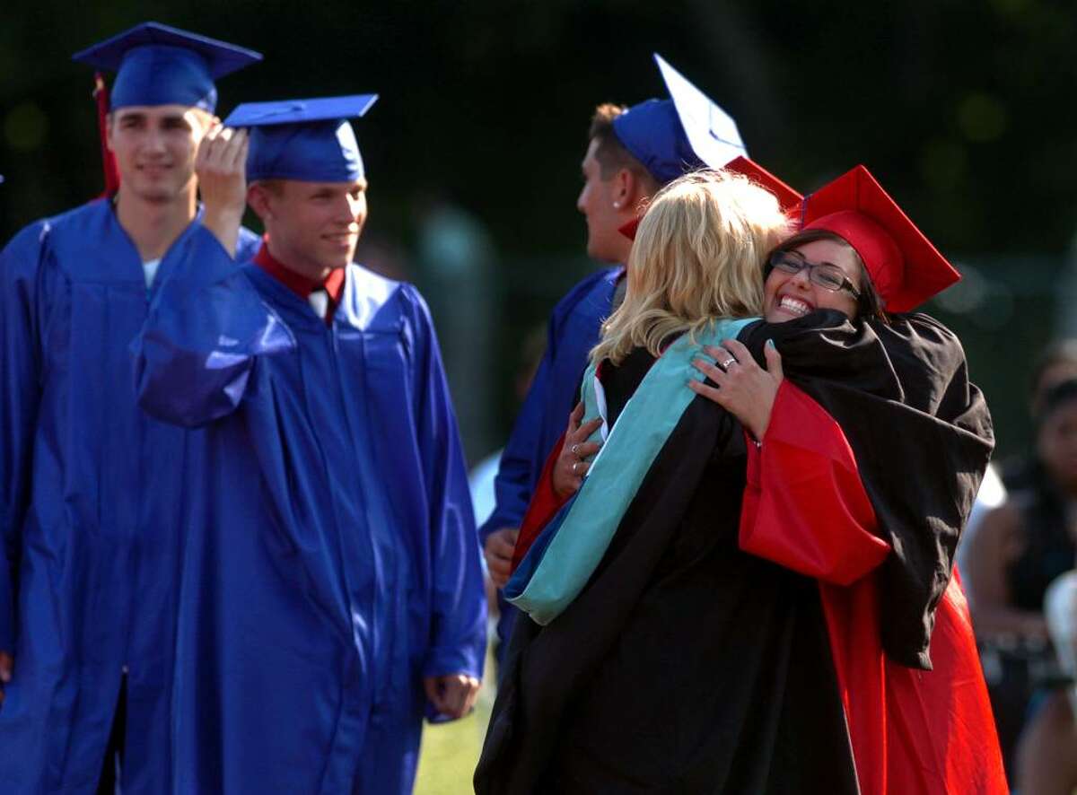 Graduate Patricia Ann Boyle, right, hugs teacher Lori Hart, during Foran High School's Graduation Exercises in Milford, Conn. on Wednesday June 23, 2010.