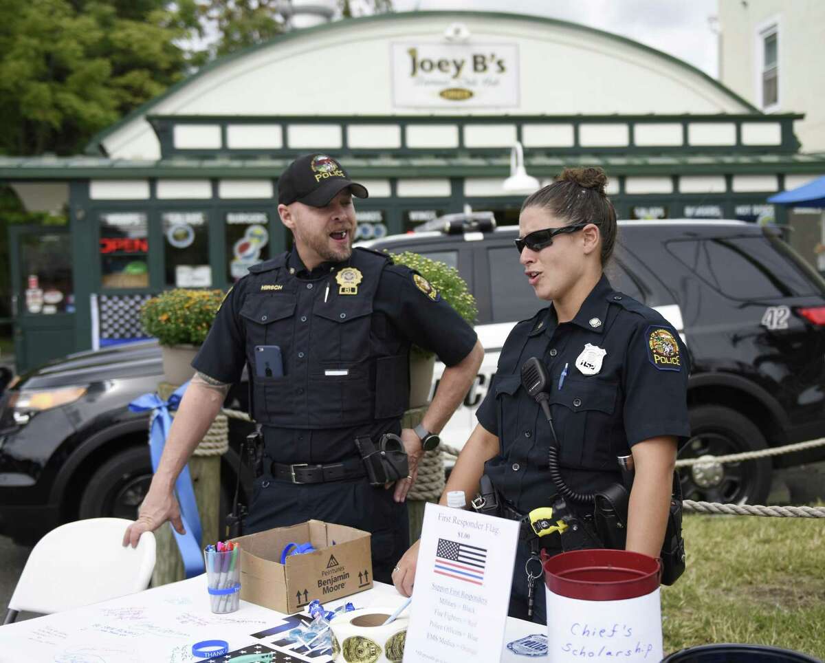 Greenwich Police Officers Keith Hirsch and Hayes Sgaglio chat during the Thank-a-Cop event at Joey B's Famous Chili Hub last year. The event will be held again on Wednesday from 6 a.m. to 8 p.m.