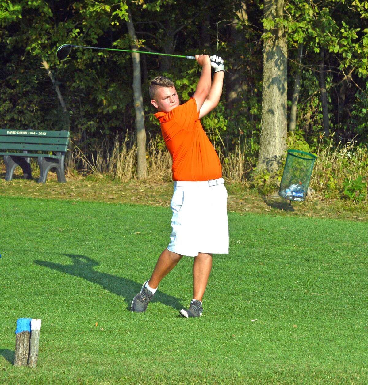 Edwardsville sophomore Ian Bailey, playing for EHS Black, hits a tee shot on hole No. 18 at Oak Brook Golf Club during the Dick Gerber Invitational on Friday.