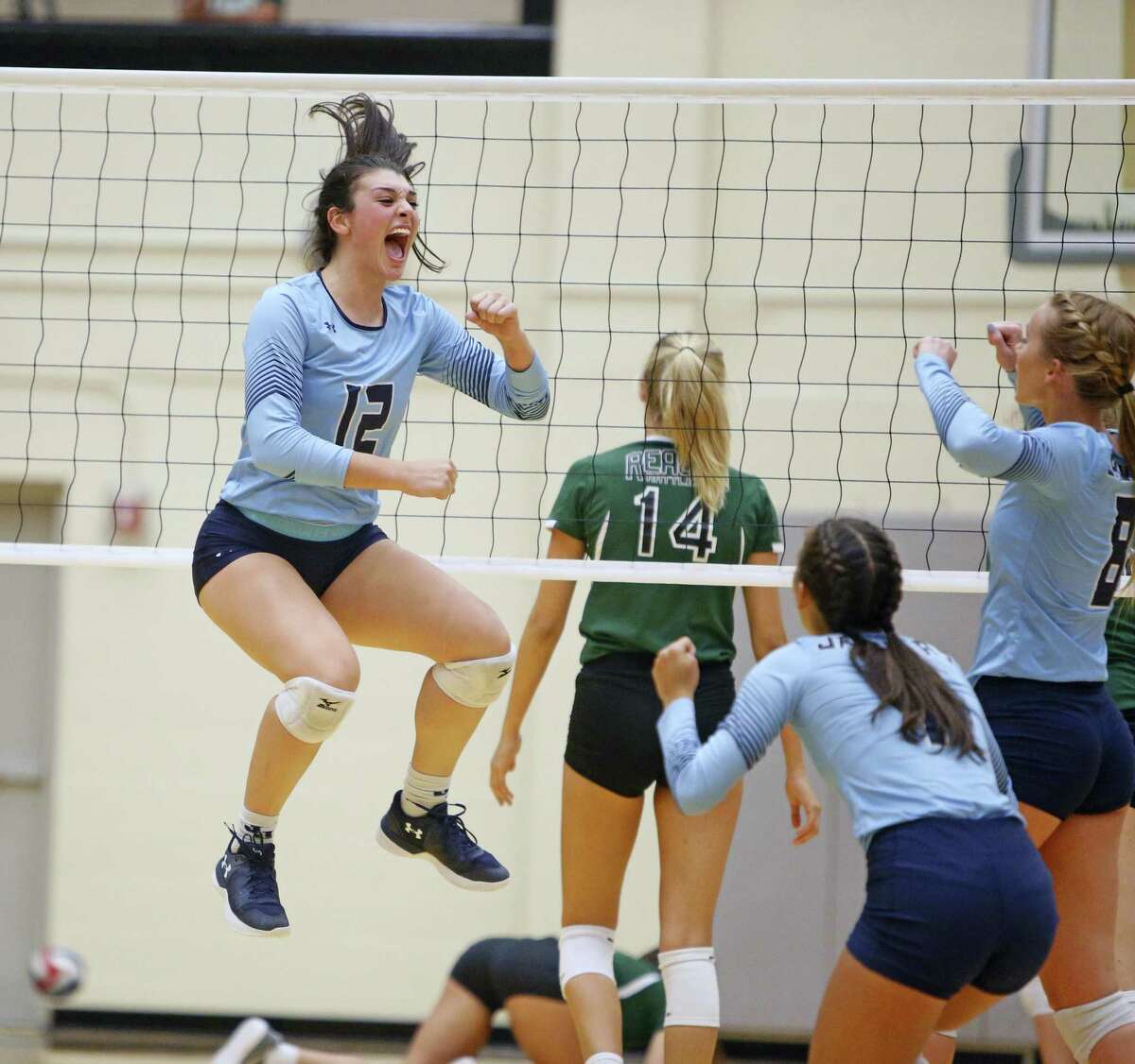 Johnson’s Julia Deais celebrates during the District 26-6A high school volleyball match between Reagan and Johnson on Sept. 22.