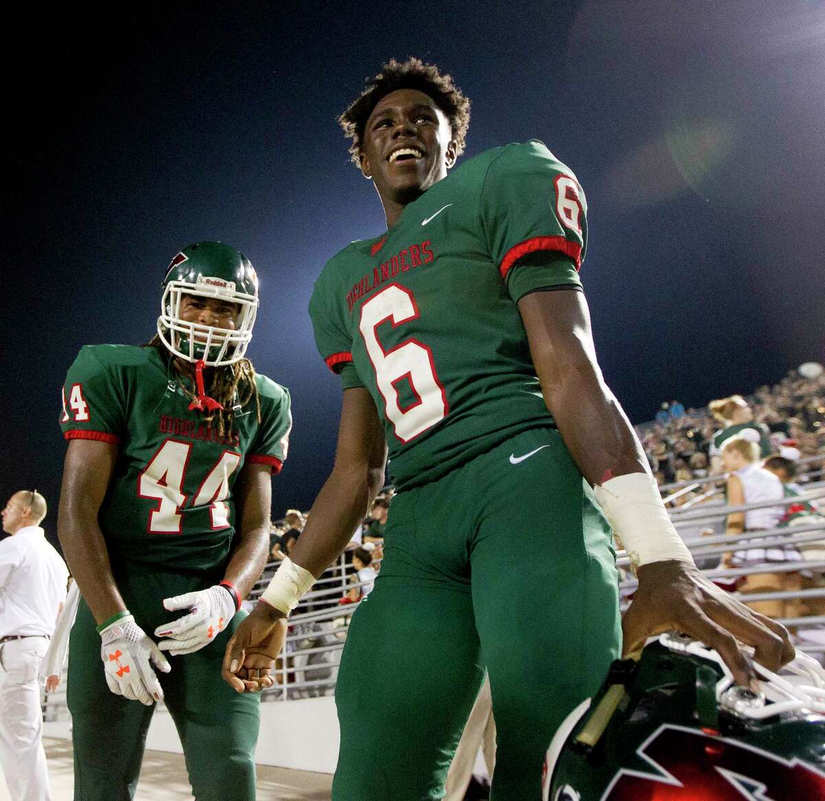 The Woodlands wide receiver Kesean Carter (6) shares a laugh with running back Jacoby Clarke (44) after scoring five touchdowns in the Highlanders' 52-12 win over George Ranch during a non-district high school football game at Woodforest Bank Stadium, Friday, Sept. 22, 2017, in Shenandoah.