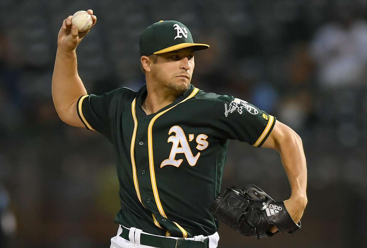 A’s starter Kendall Graveman pitches in as clubhouse attendant