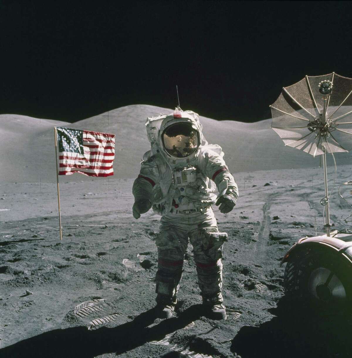 In this Dec. 12, 1972, photo provided by NASA, Apollo 17 commander Eugene Cernan stands on the moon. (NASA via AP)