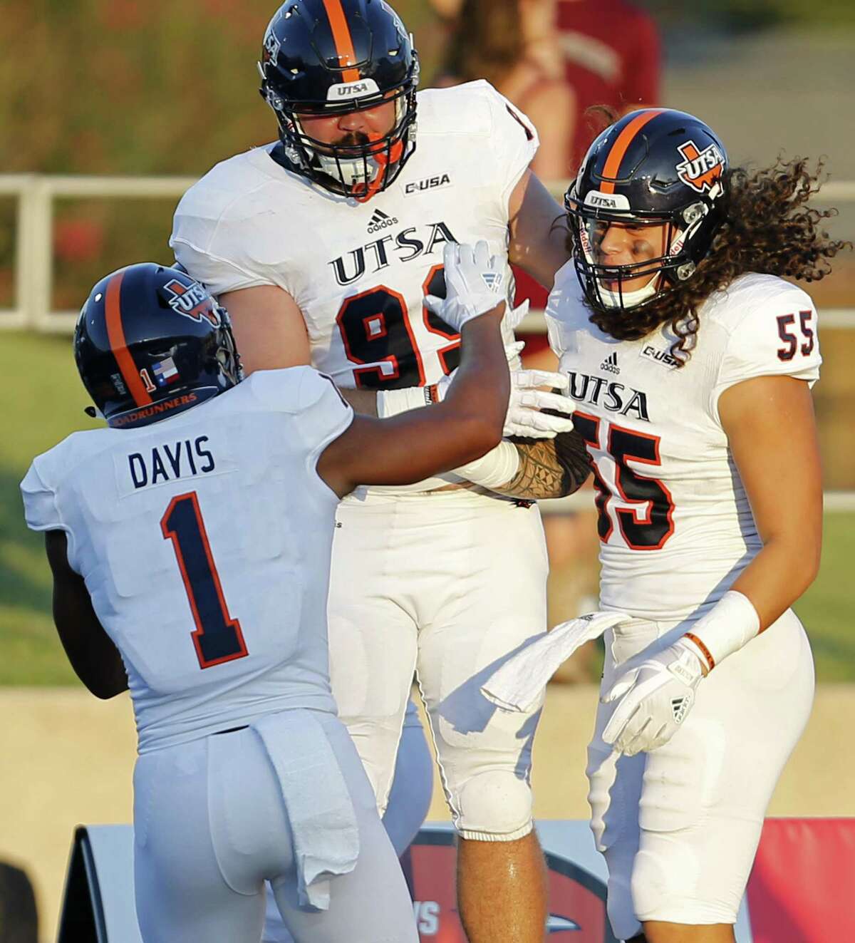 UTSA Roadrunners linebacker Josiah Tauaefa (55), right, celebrates with teammates UTSA Roadrunners cornerback Devron Davis (1) and UTSA Roadrunners defensive end Baylen Baker (99) after scoring a touchdown on a fumble recovery against the Texas State Bobcats during first half action on Sept. 23, 2017 at Bobcat Stadium in San Marcos.