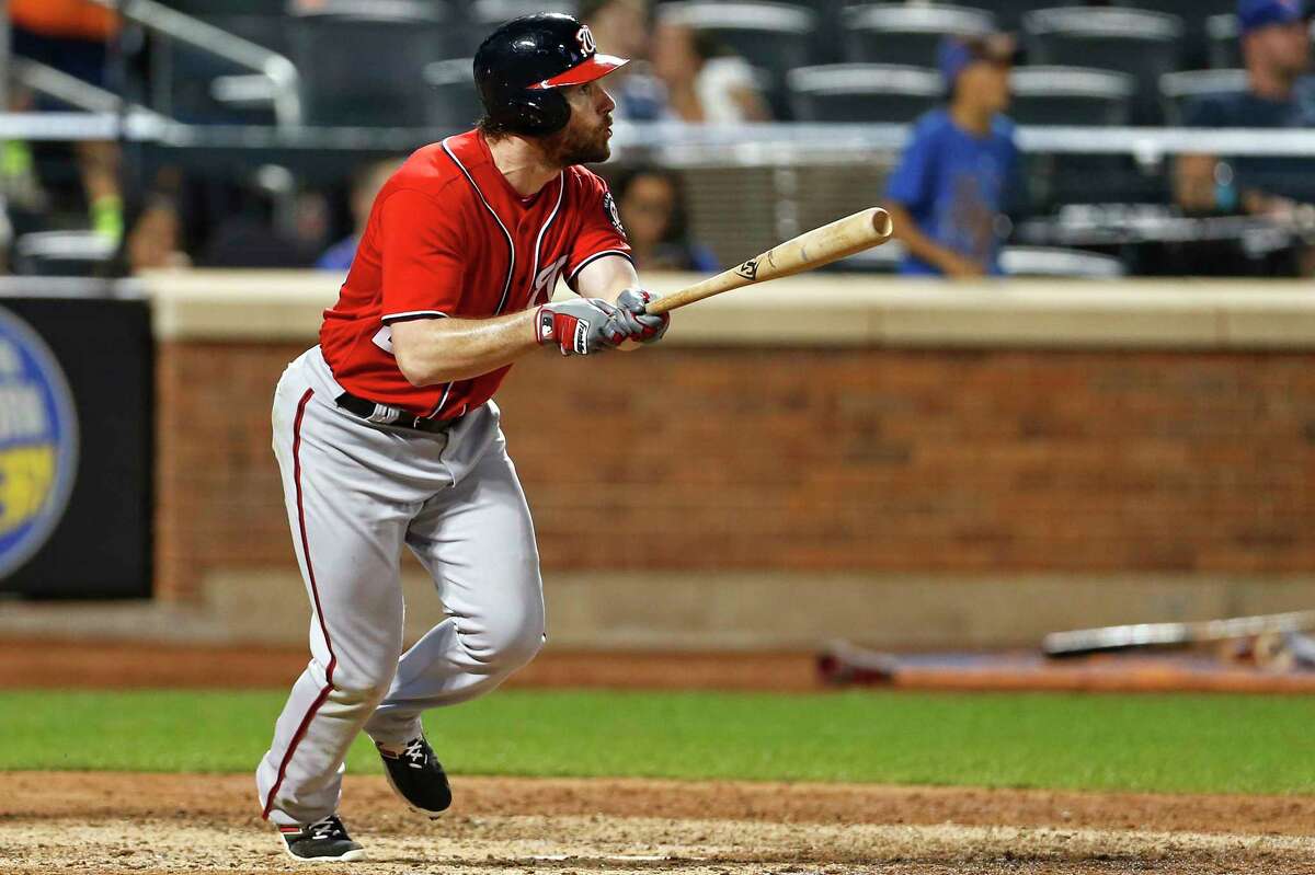 Washington Nationals' Daniel Murphy watches his solo home run during the 10th inning of a baseball game against the New York Mets on Saturday, Sept. 23, 2017, in New York. (AP Photo/Adam Hunger) ORG XMIT: NYM119