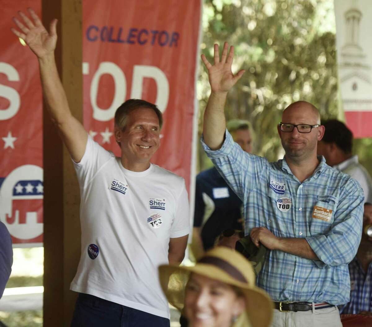 Incumbent Board of Education Chairman Peter Sherr, left, and Board of Education nominee Jason Auerbach wave to the crowd at the annual Republican clambake at Greenwich Point Park in Old Greenwich, Conn. Sunday, Sept. 24, 2017. First Selectman Peter Tesei, Selectman John Toner, Tax Collector Tod Laudonia and other Republican candidates spoke to rally the base before the upcoming municipal election on November 7.