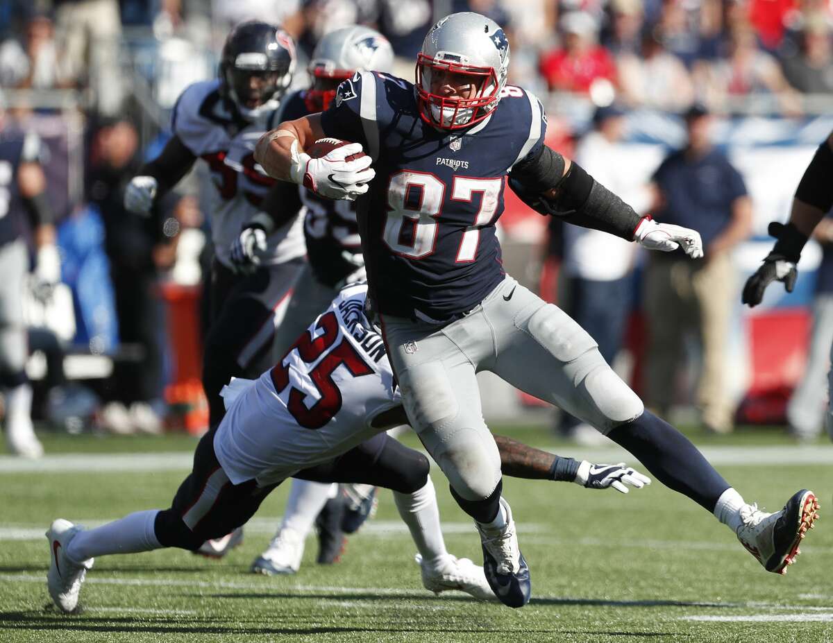 PHOTOS: Texans work a day with United Airlines at IAH  New England Patriots tight end Rob Gronkowski (87) runs past Houston Texans cornerback Kareem Jackson (25) for a first down reception during the third quarter of an NFL football game at Gillette Stadium on Sunday, Sept. 24, 2017, in Foxbourough, Mass. ( Brett Coomer / Houston Chronicle ) >>>See Texans players lend a hand with United Airlines at George Bush Intercontinental Airport ... 