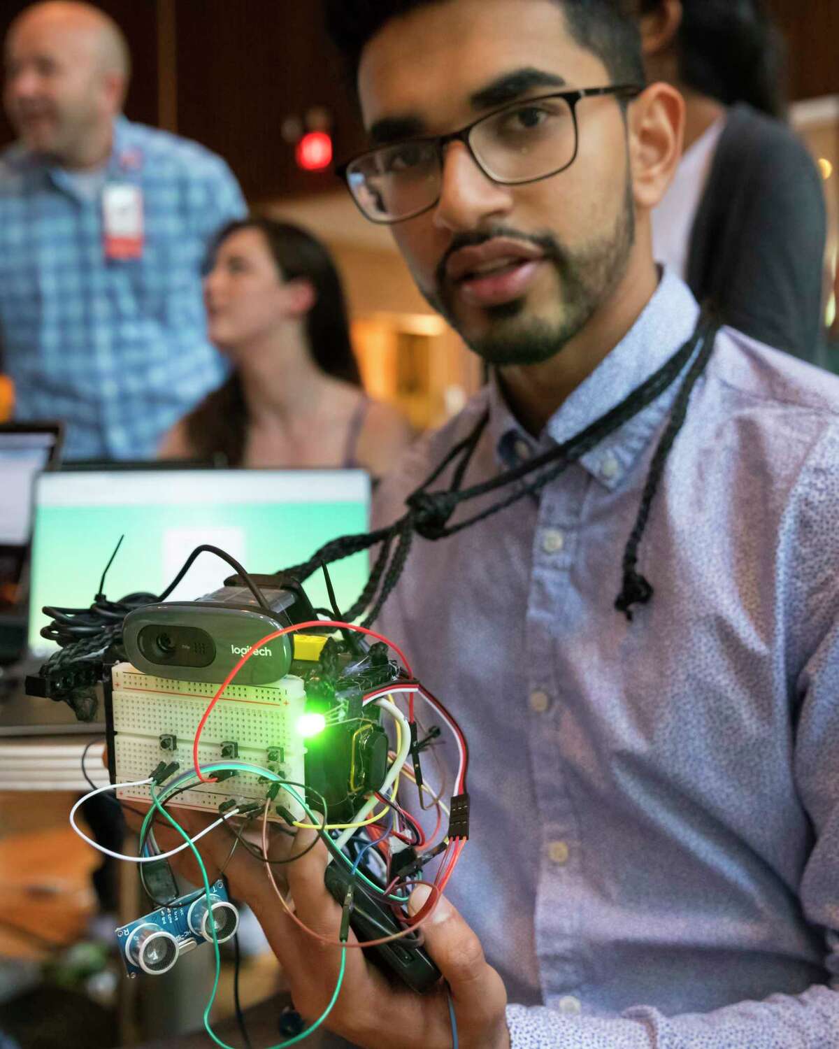 Harsh Patel holds the Memoreyes facial recognition device during HackRice, Rice University's annual hackathron event sponsored by the university's Computer Science Club.