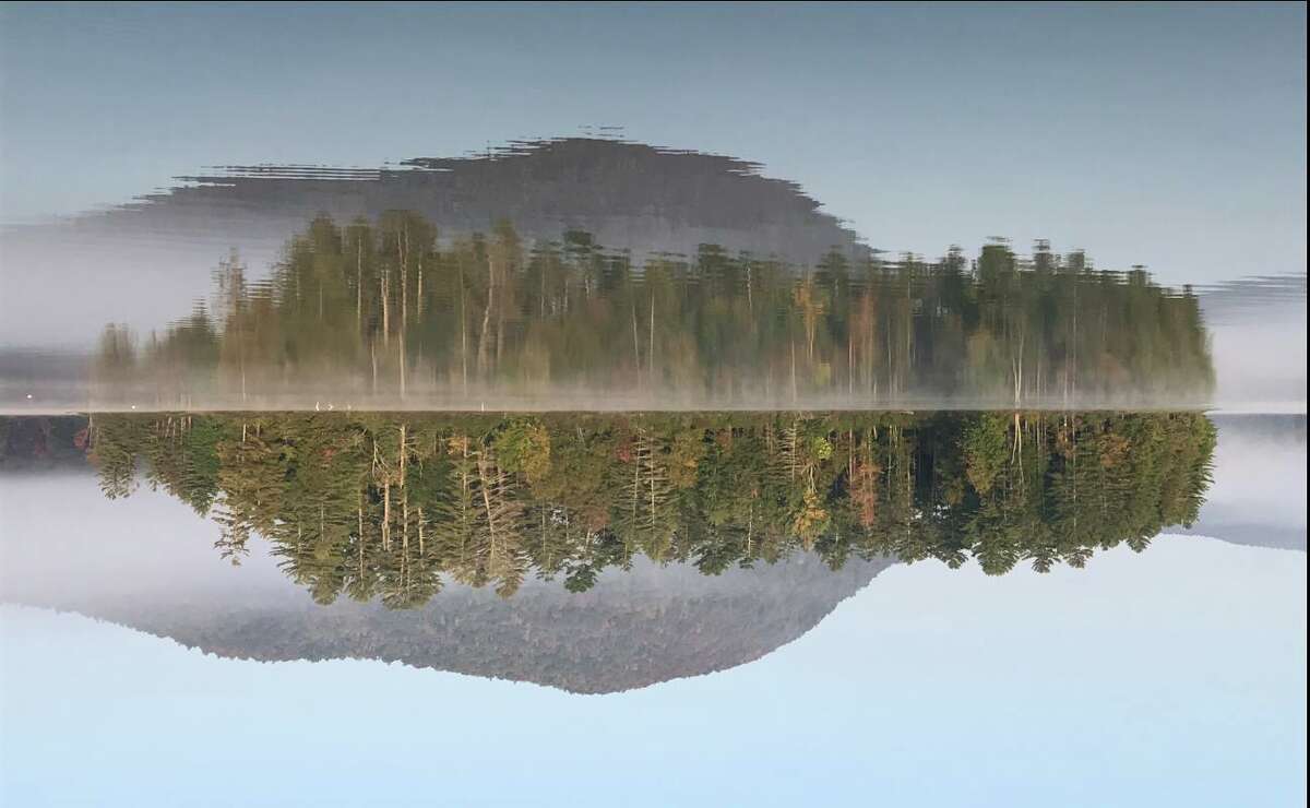 Gerry Morris of Schenectady shares a reflection of Piseco Lake?s Pine Island this season from a different point of view.