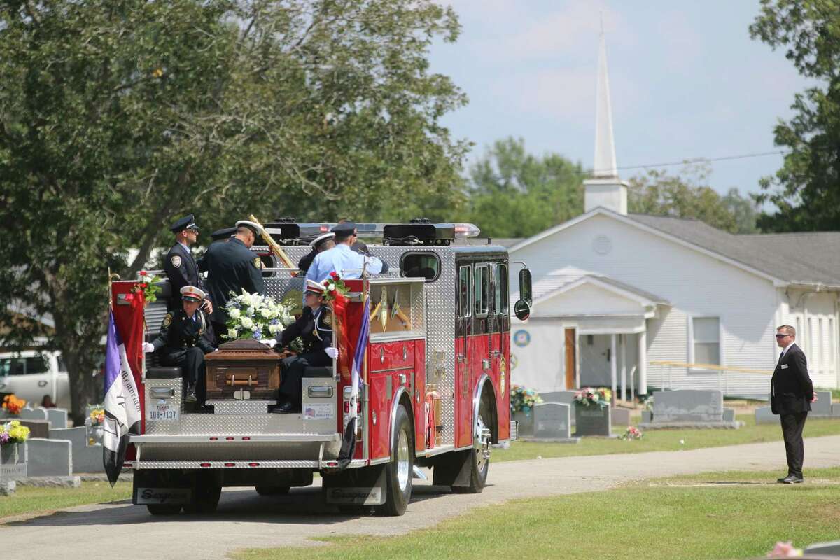 The casket of firefighter Brian Sumrall arrives at Guedry Cemetery in Batson Friday after a funeral service at North Main Baptist Church in Liberty. Sumrall, a firefighter for Houston and Batson fire departments, was tragically killed in an accident near his Batson home on Sept. 17.