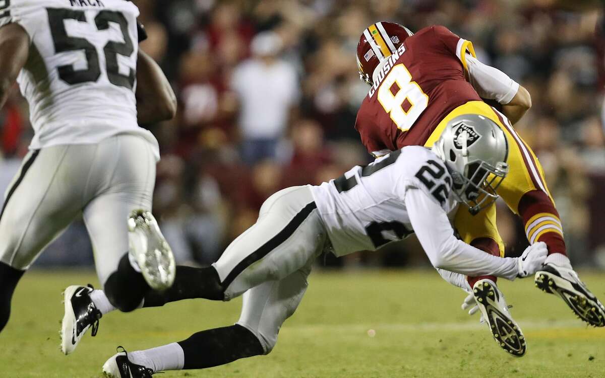 Quarterback Kirk Cousins #8 of the Washington Redskins is sacked by cornerback Gareon Conley #22 of the Oakland Raiders in the third quarter against the Oakland Raiders at FedExField on September 4, 2017 in Landover, Maryland. The Raiders “might likely” play in Oakland through the 2020 season as they wait for their $1.9 billion Las Vegas stadium to be built, a Coliseum official said Monday.