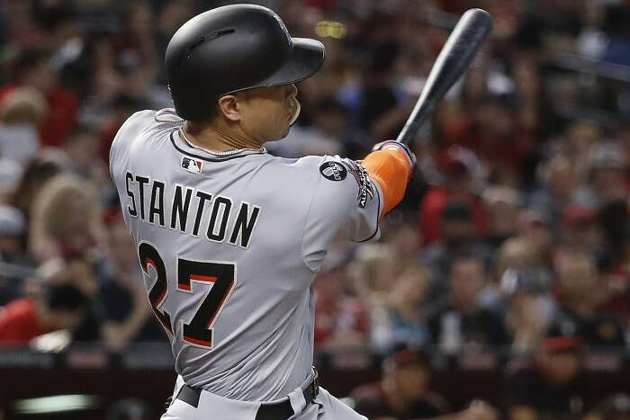 Dee Gordon and Giancarlo Stanton by Mike Ehrmann