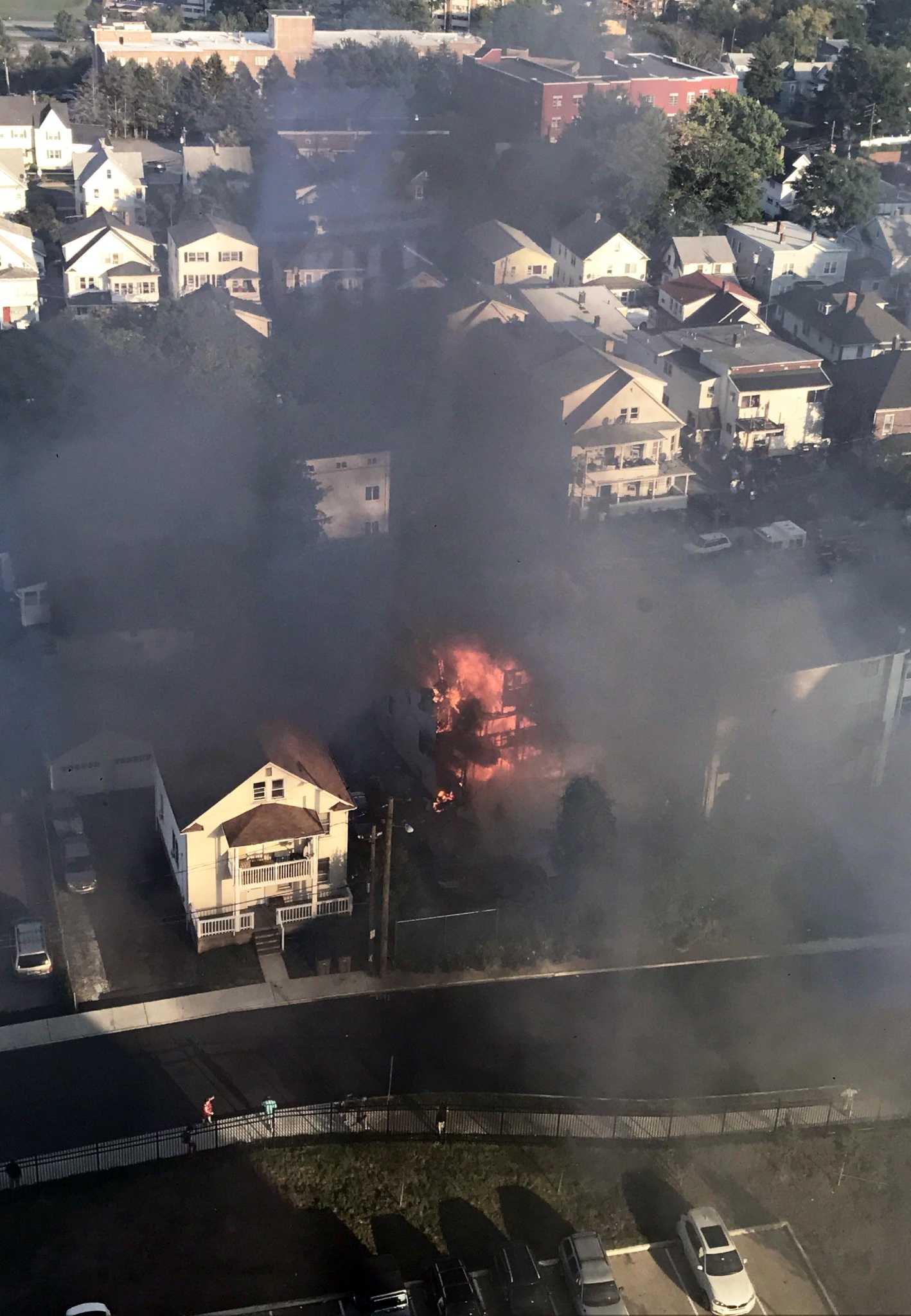 Family aids neighbors trapped on roof during house fire near Stamford Hospital ...