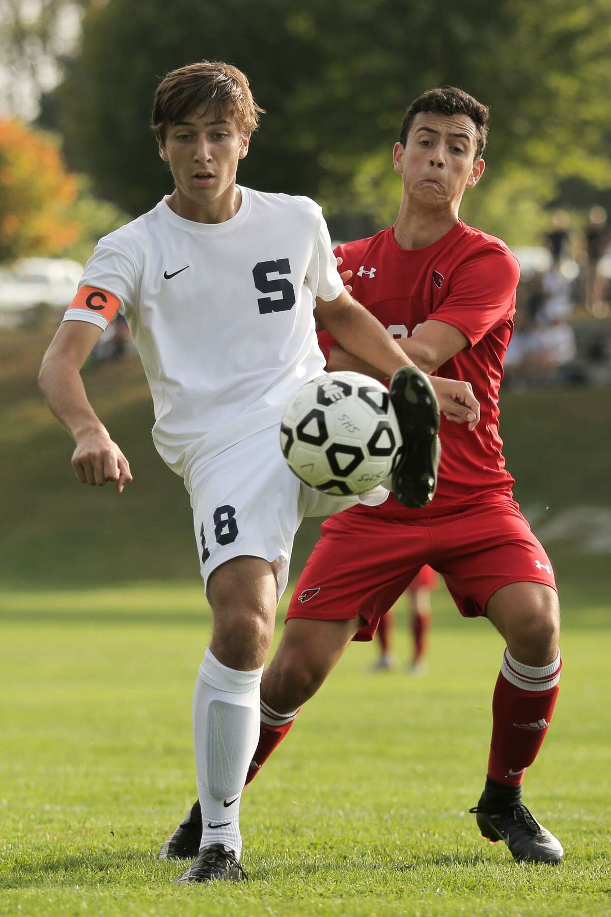 Matt Engler keeps the ball from Martin Garcia during Staples' 1-0 victory over Greenwich at Staples High School in Westport, Conn. on Monday, September 25, 2017.