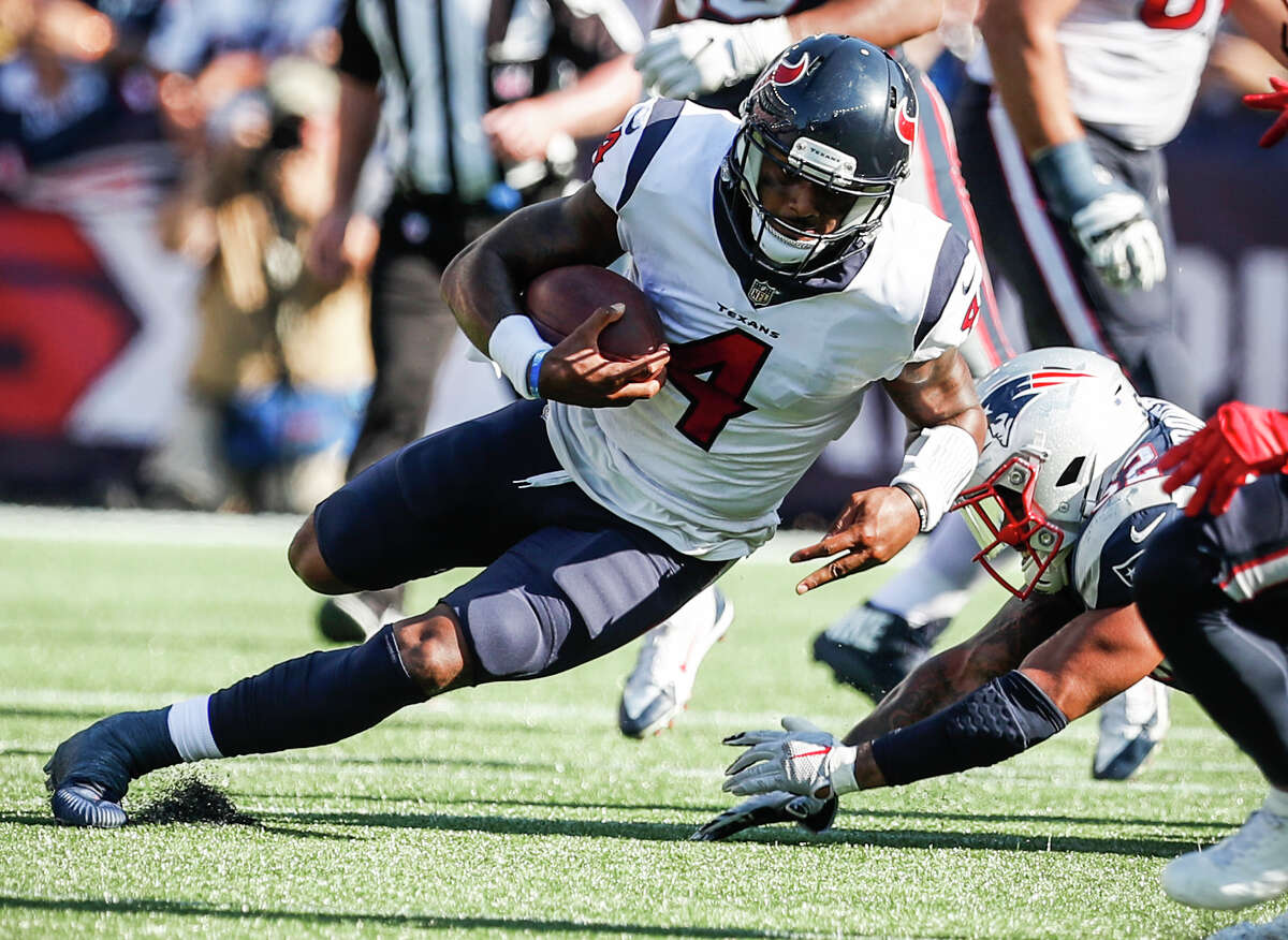 Houston Texans quarterback Deshaun Watson (4) runs for a first down past ]New England Patriots outside linebacker Elandon Roberts (52) during the fourth quarter of an NFL football game at Gillette Stadium on Sunday, Sept. 24, 2017, in Foxbourough, Mass. ( Brett Coomer / Houston Chronicle )