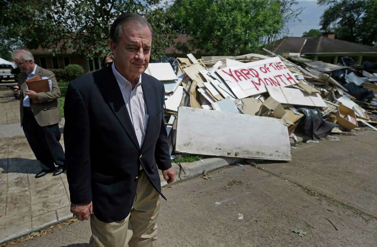 John Sharp tours a flooded neighborhood near Westbury High School last week ﻿in Houston. He routinely gives his cellphone number to officials.